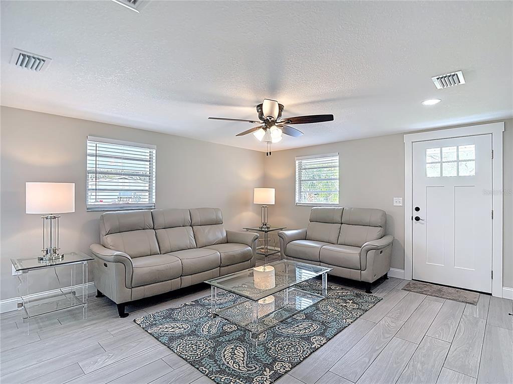 14306 Guava Street Hudson, FL 34667 - Photo 3 of 39 a living room with furniture and a window