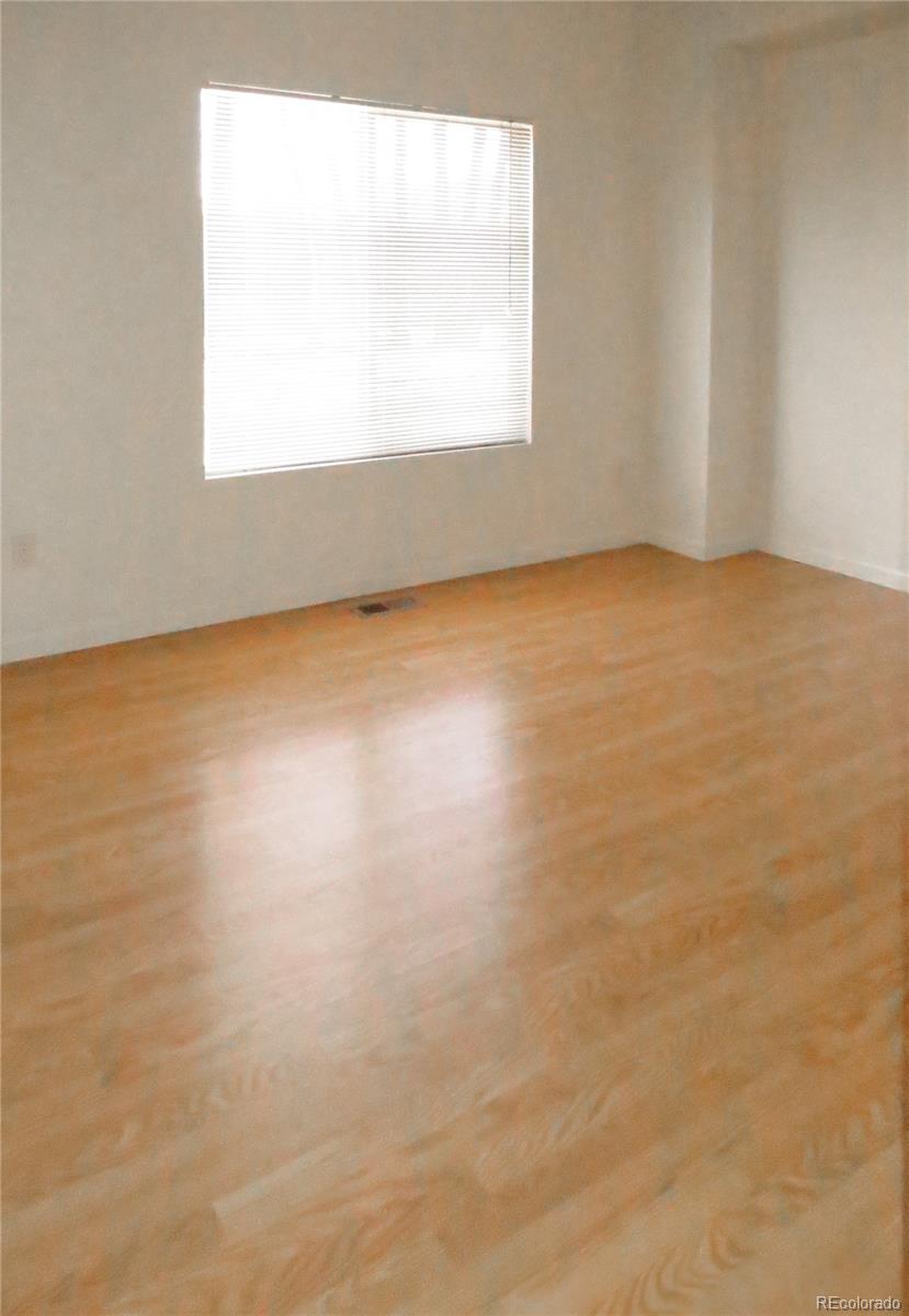 2141 Legacy Ridge View, Unit 101 Colorado Springs, CO 80910 - Photo 4 of 14 an empty room with a window