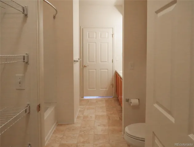 a bathroom with a shower and a toilet