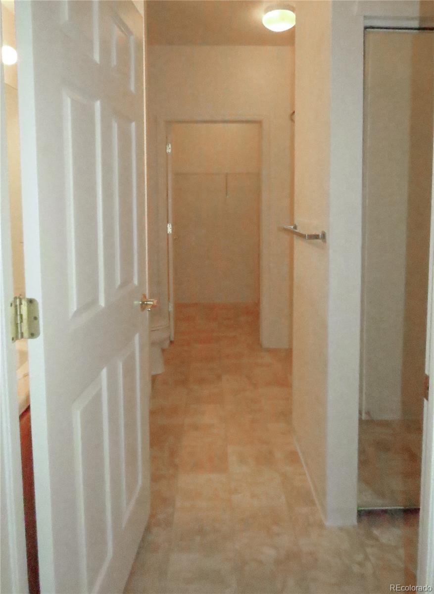 2141 Legacy Ridge View, Unit 101 Colorado Springs, CO 80910 - Photo 6 of 14 a bathroom with a shower