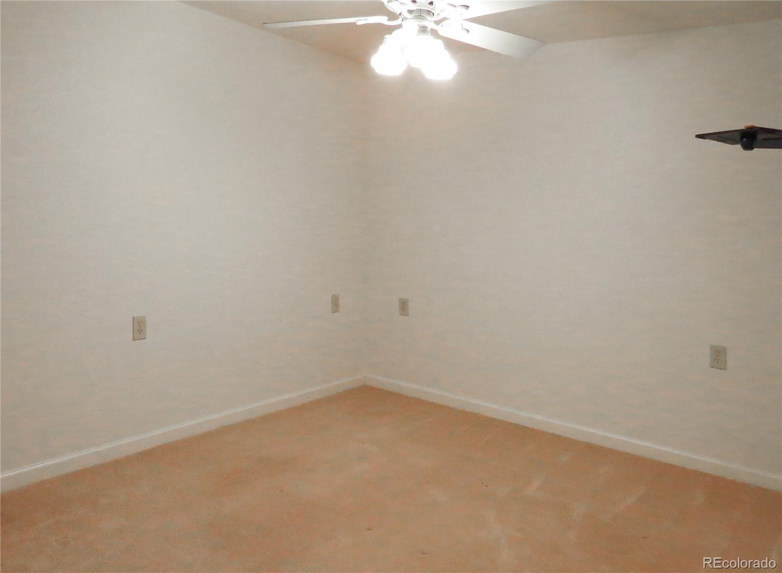 2141 Legacy Ridge View, Unit 101 Colorado Springs, CO 80910 - Photo 10 of 14 a view of a small space with a fan