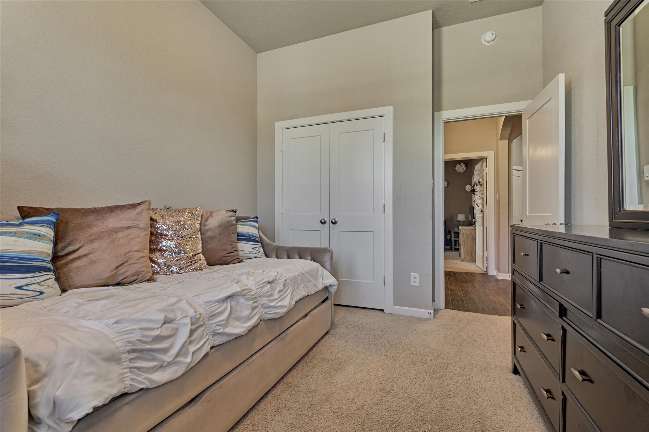 17015 Ash Leaf Way Conroe, TX 77385 - Photo 16 of 25 a large bedroom with a bed and furniture