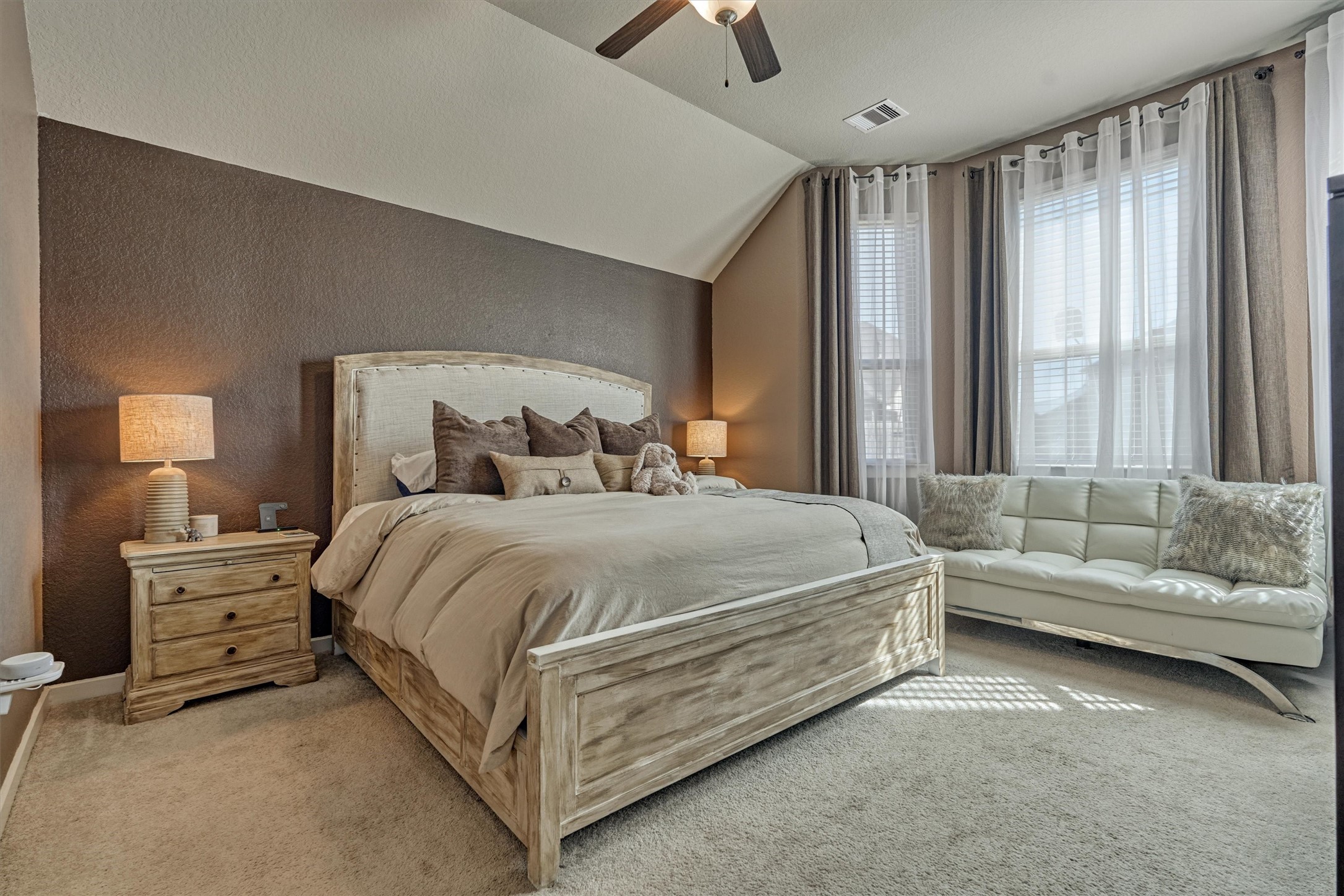 17015 Ash Leaf Way Conroe, TX 77385 - Photo 18 of 25 a bedroom with a bed couch and window