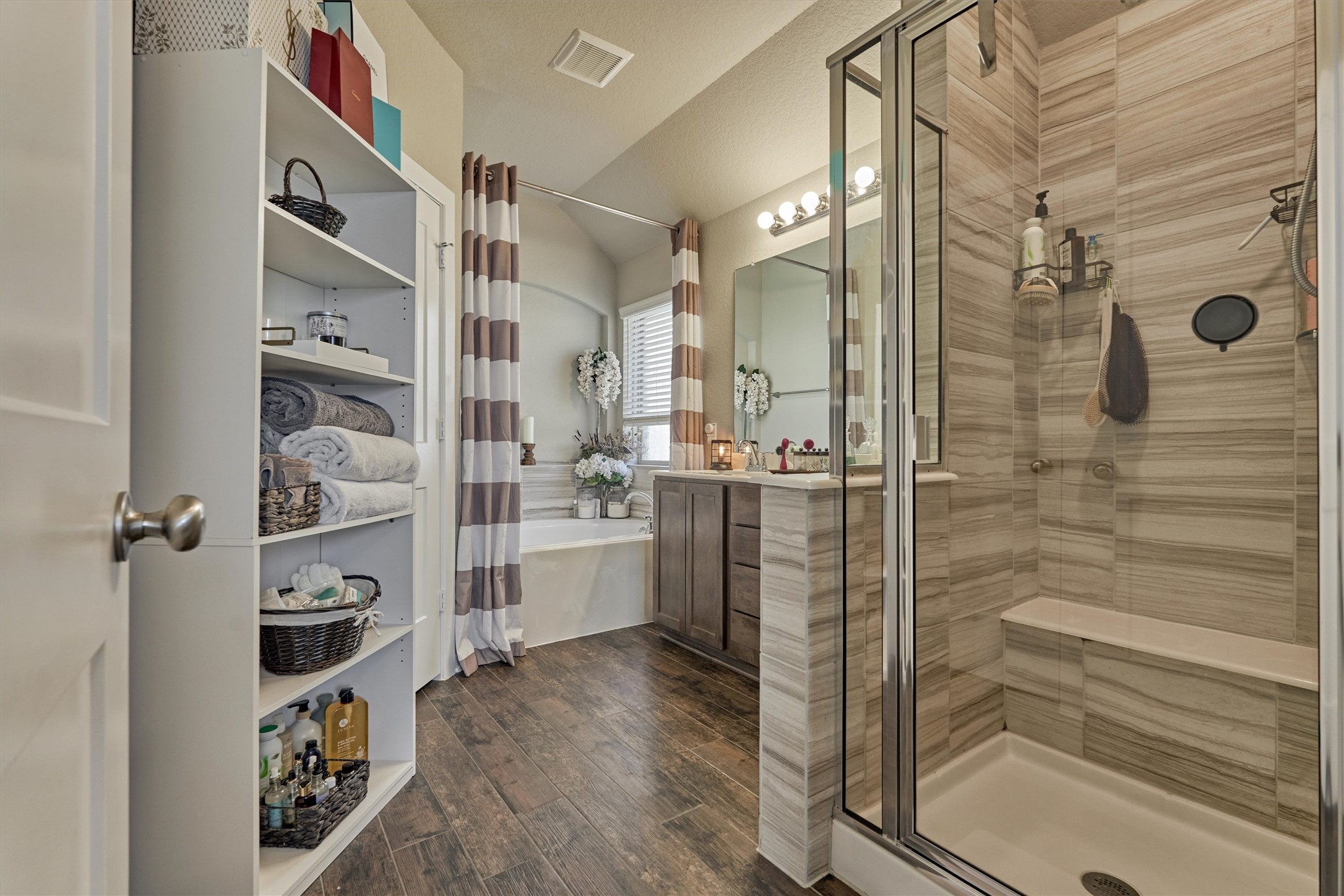 17015 Ash Leaf Way Conroe, TX 77385 - Photo 20 of 25 a bathroom with a glass shower door and a sink