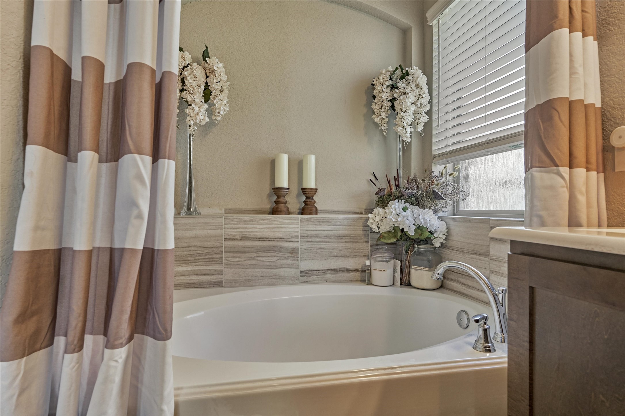 17015 Ash Leaf Way Conroe, TX 77385 - Photo 21 of 25 a bathroom with a bathtub and a shower