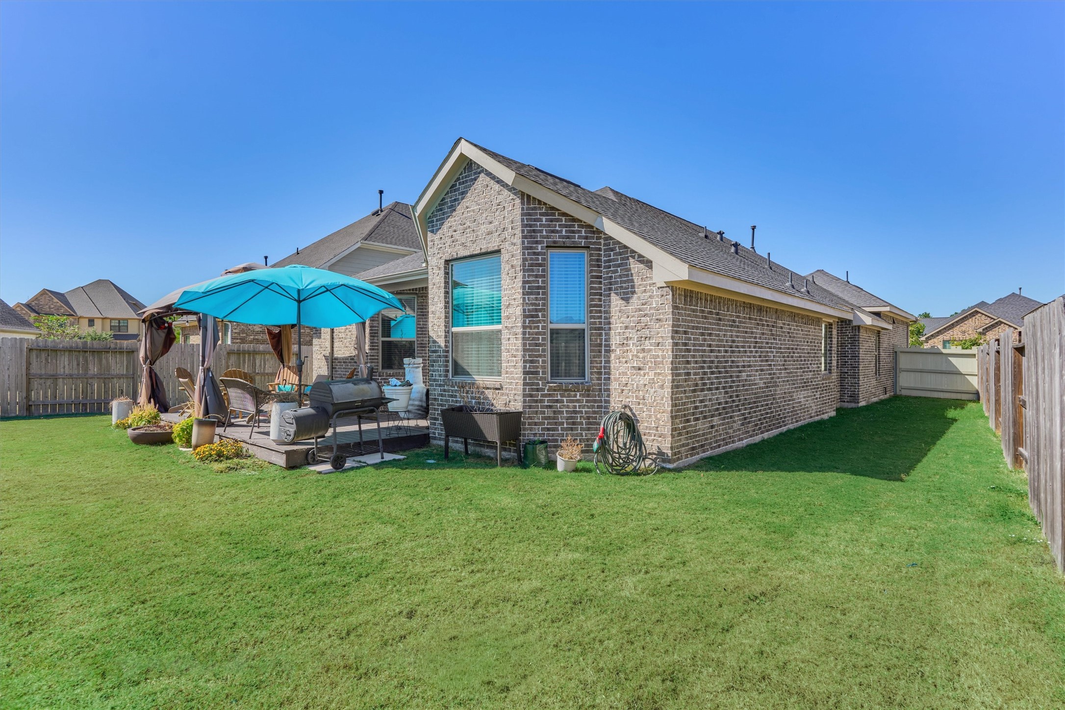 17015 Ash Leaf Way Conroe, TX 77385 - Photo 22 of 25 a view of a house with backyard and porch