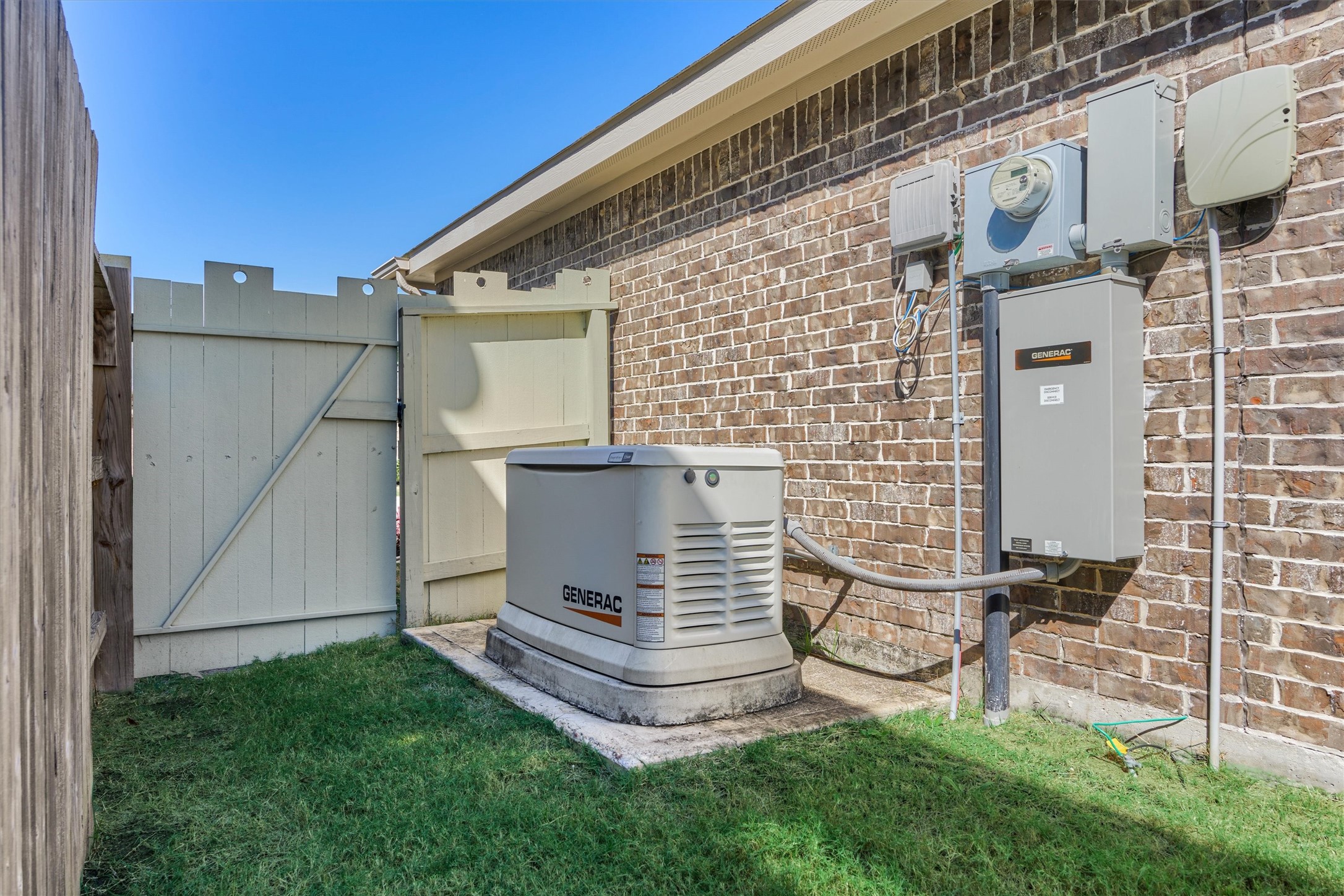 17015 Ash Leaf Way Conroe, TX 77385 - Photo 24 of 25 a view of backyard with brick wall and a chair