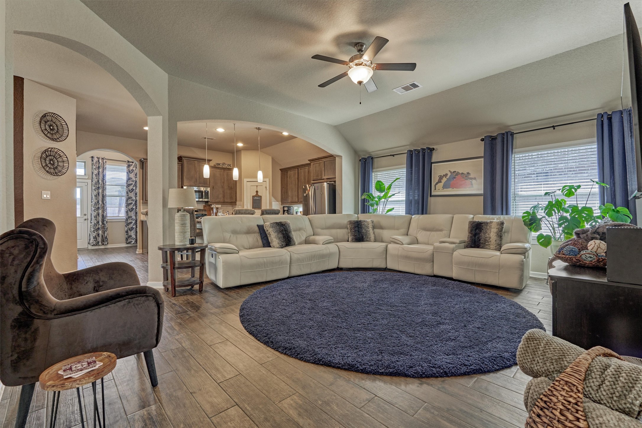 17015 Ash Leaf Way Conroe, TX 77385 - Photo 5 of 25 a living room with furniture wooden floor and a chandelier