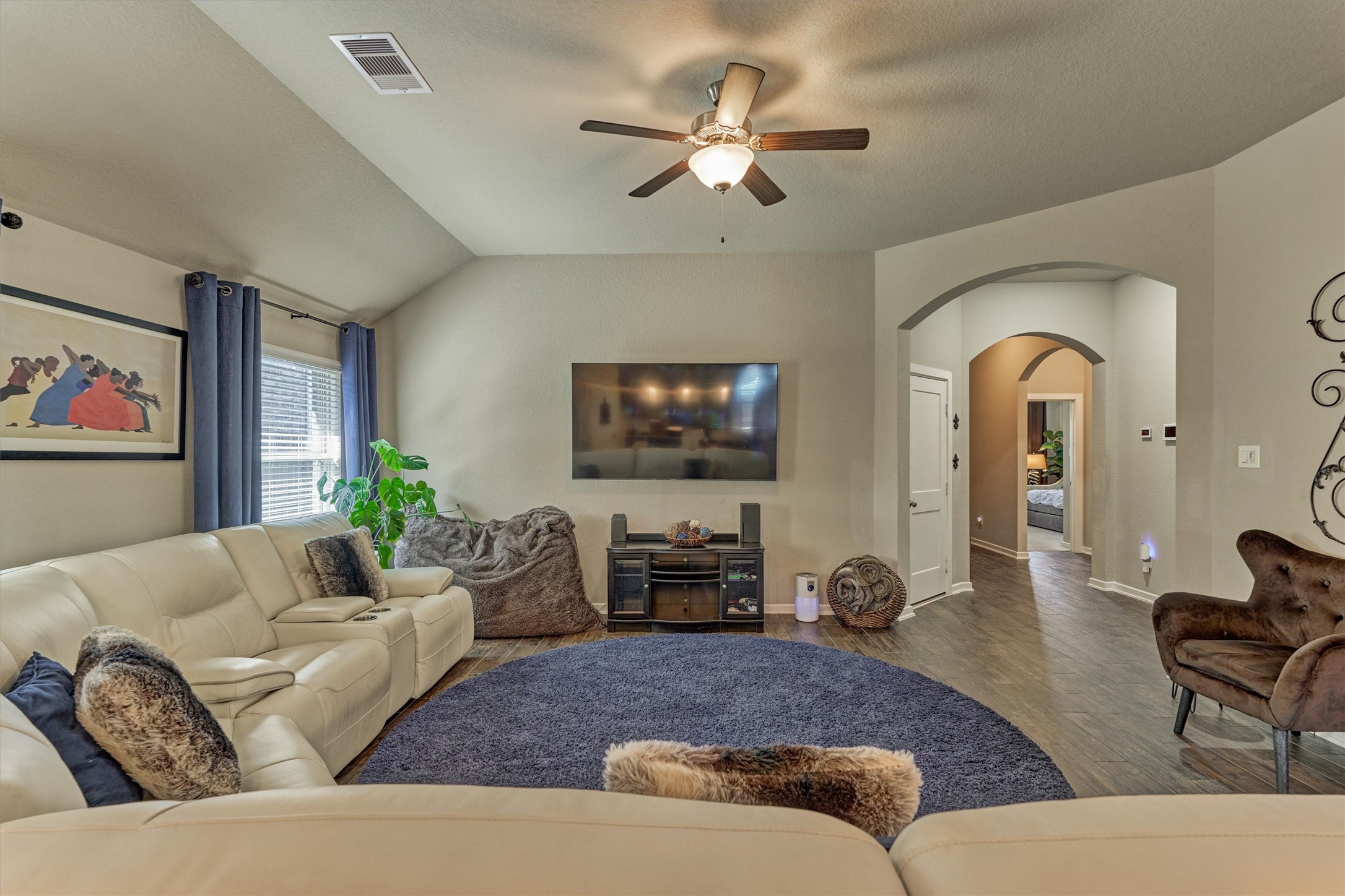 17015 Ash Leaf Way Conroe, TX 77385 - Photo 7 of 25 a living room with furniture a couch and a chandelier