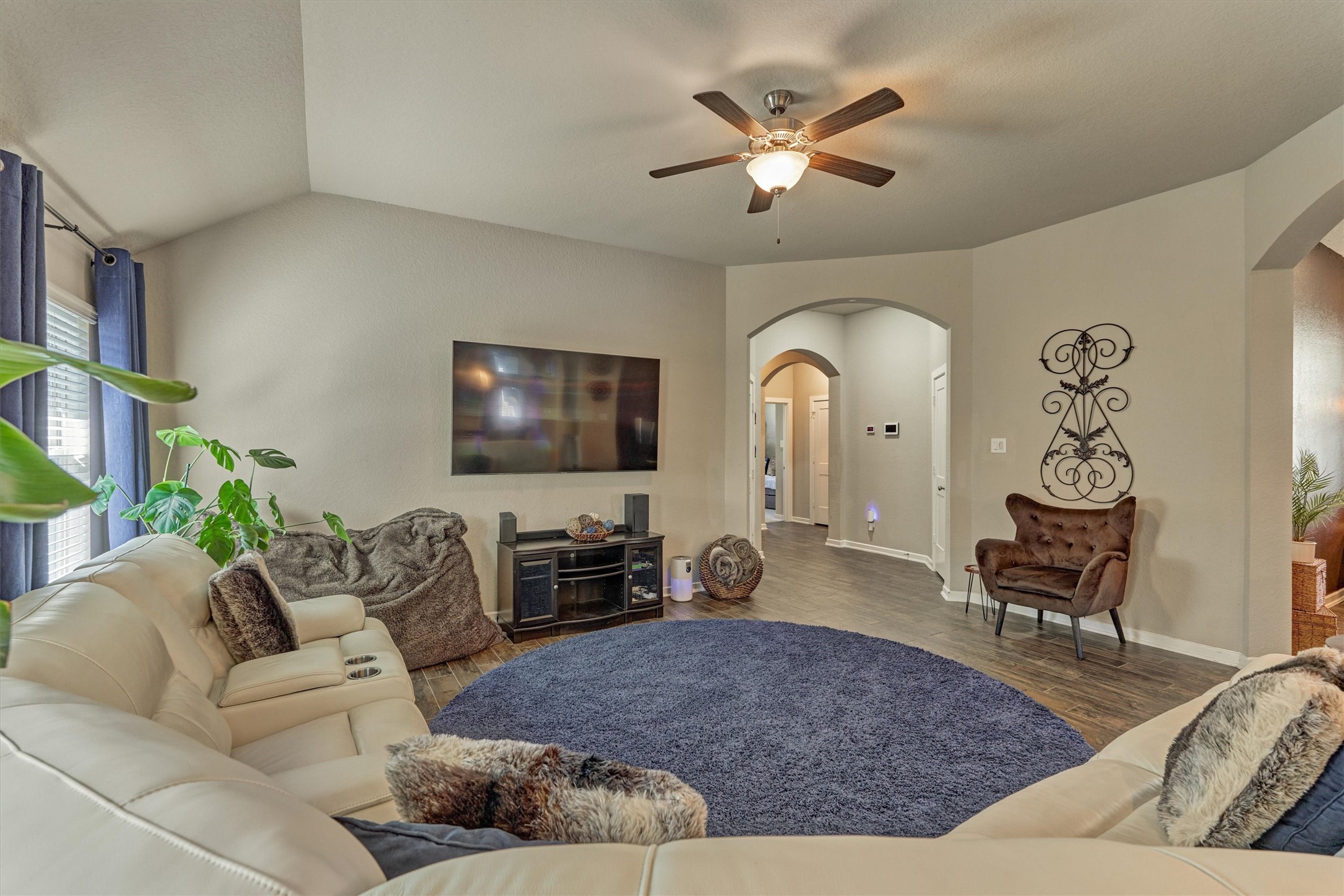 17015 Ash Leaf Way Conroe, TX 77385 - Photo 8 of 25 a living room with furniture and a flat screen tv