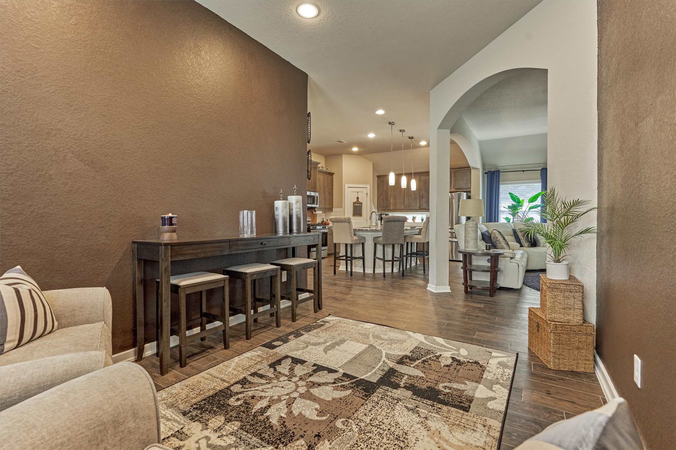 17015 Ash Leaf Way Conroe, TX 77385 - Photo 10 of 25 a living room with furniture and a dining table