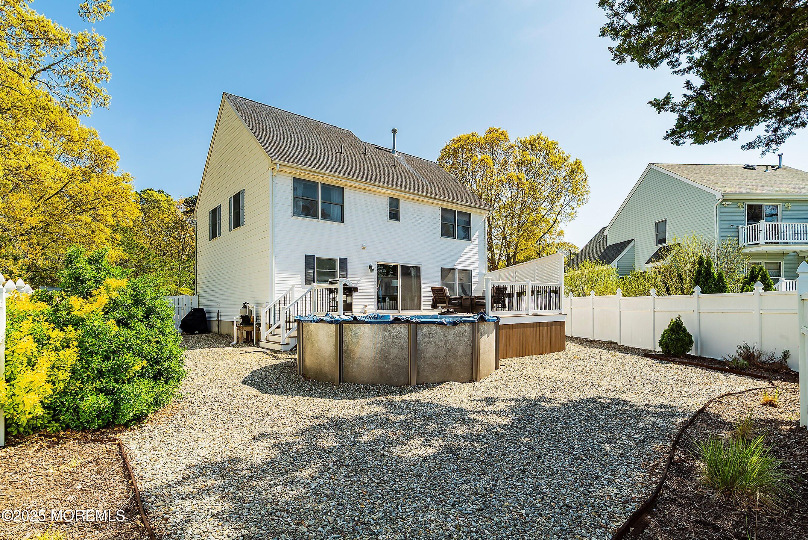 39 Ivy Court Bayville, NJ 08721 - Photo 16 of 33 a view of a house with a patio