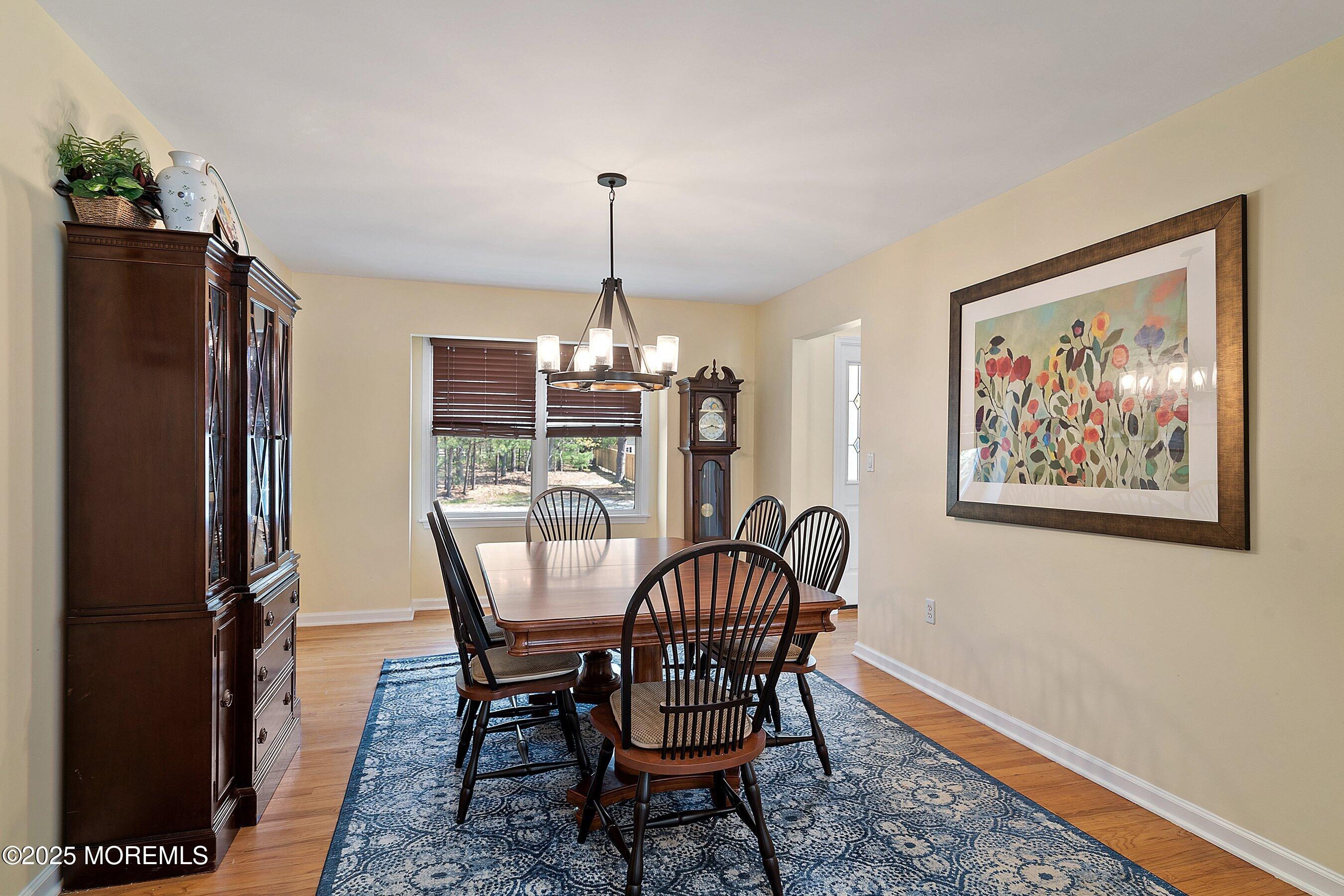 39 Ivy Court Bayville, NJ 08721 - Photo 2 of 33 a view of a dining room with furniture window and wooden floor