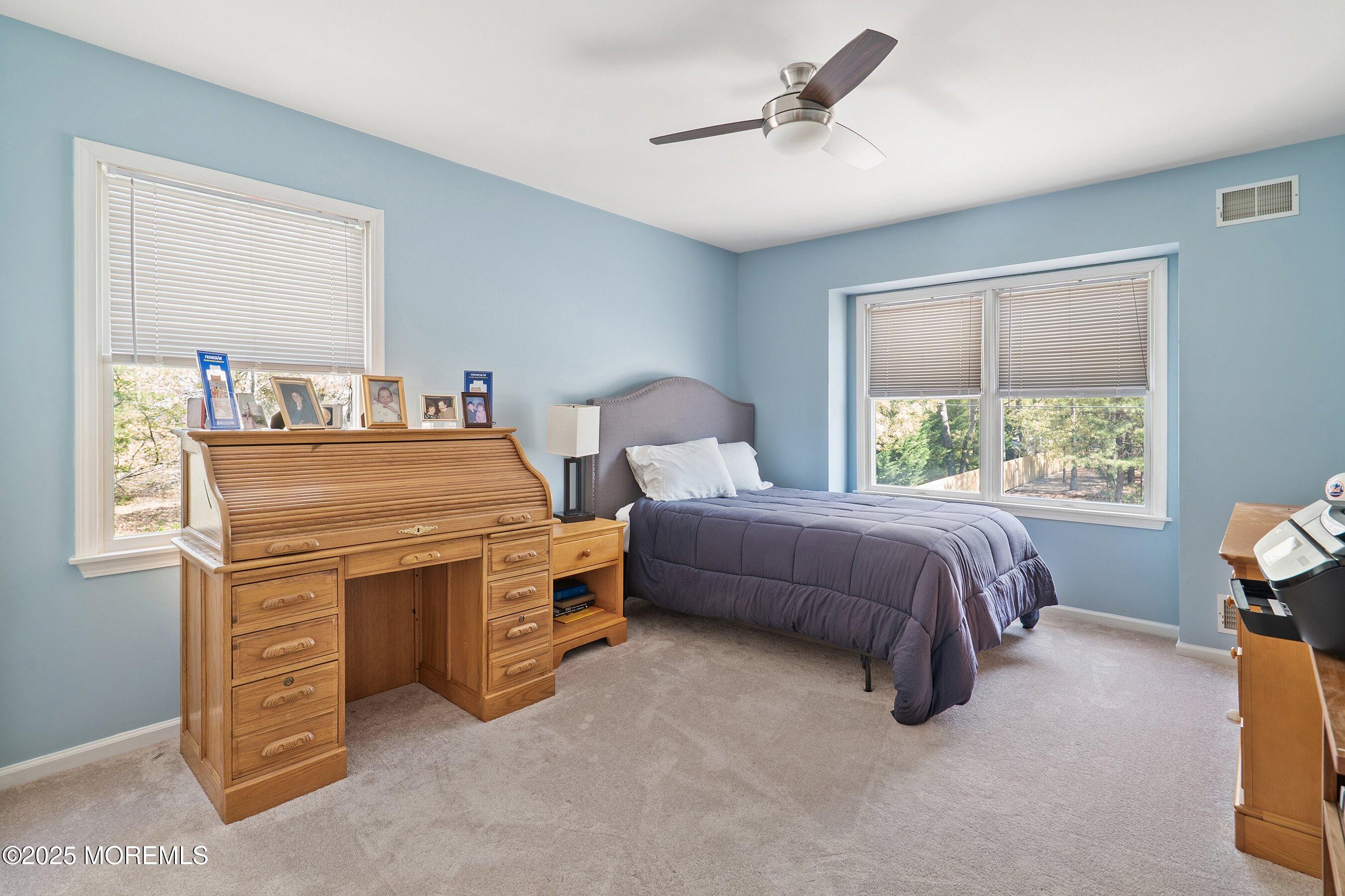 39 Ivy Court Bayville, NJ 08721 - Photo 24 of 33 a bed room with a bed and a chair