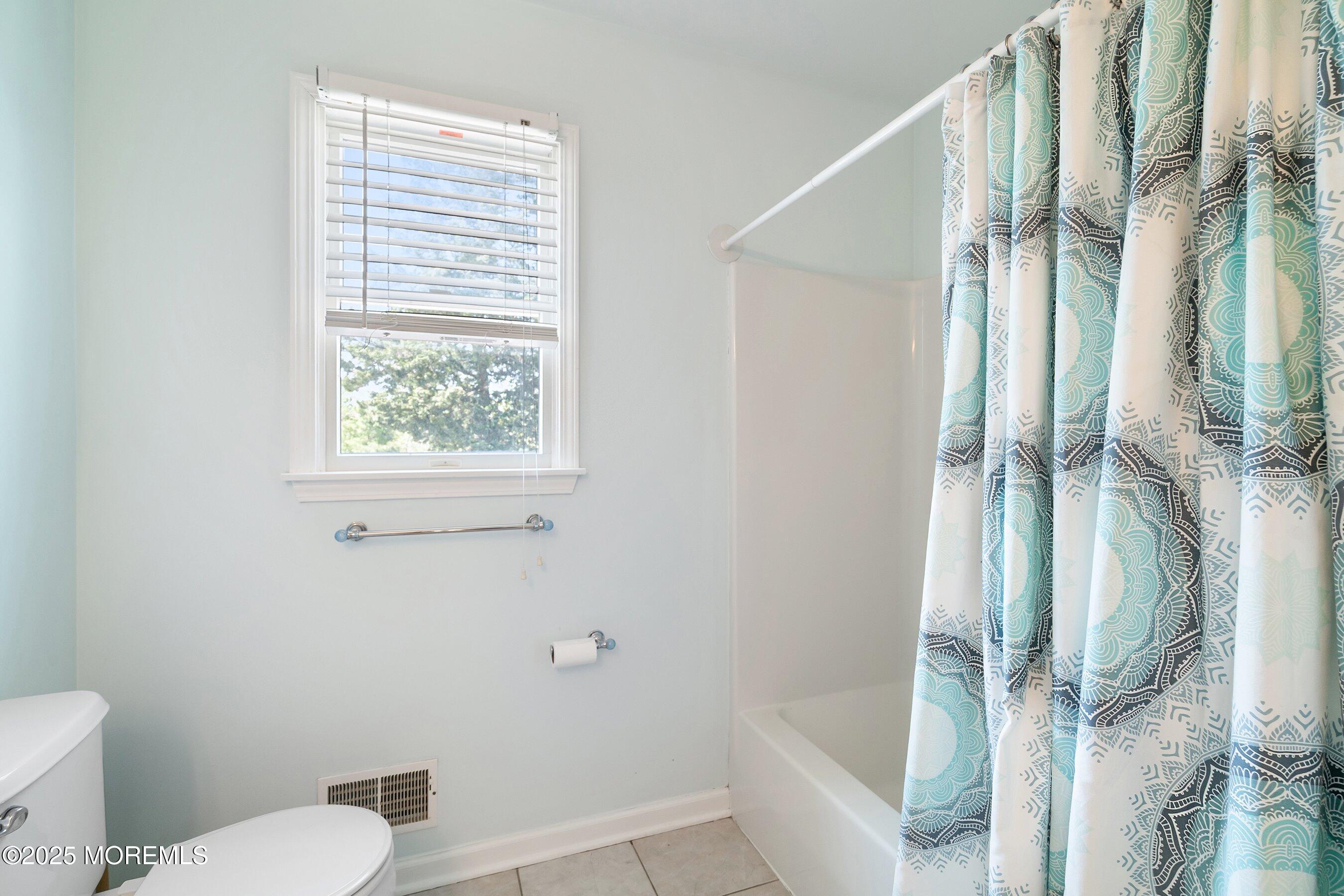 39 Ivy Court Bayville, NJ 08721 - Photo 26 of 33 a bathroom with a toilet and shower