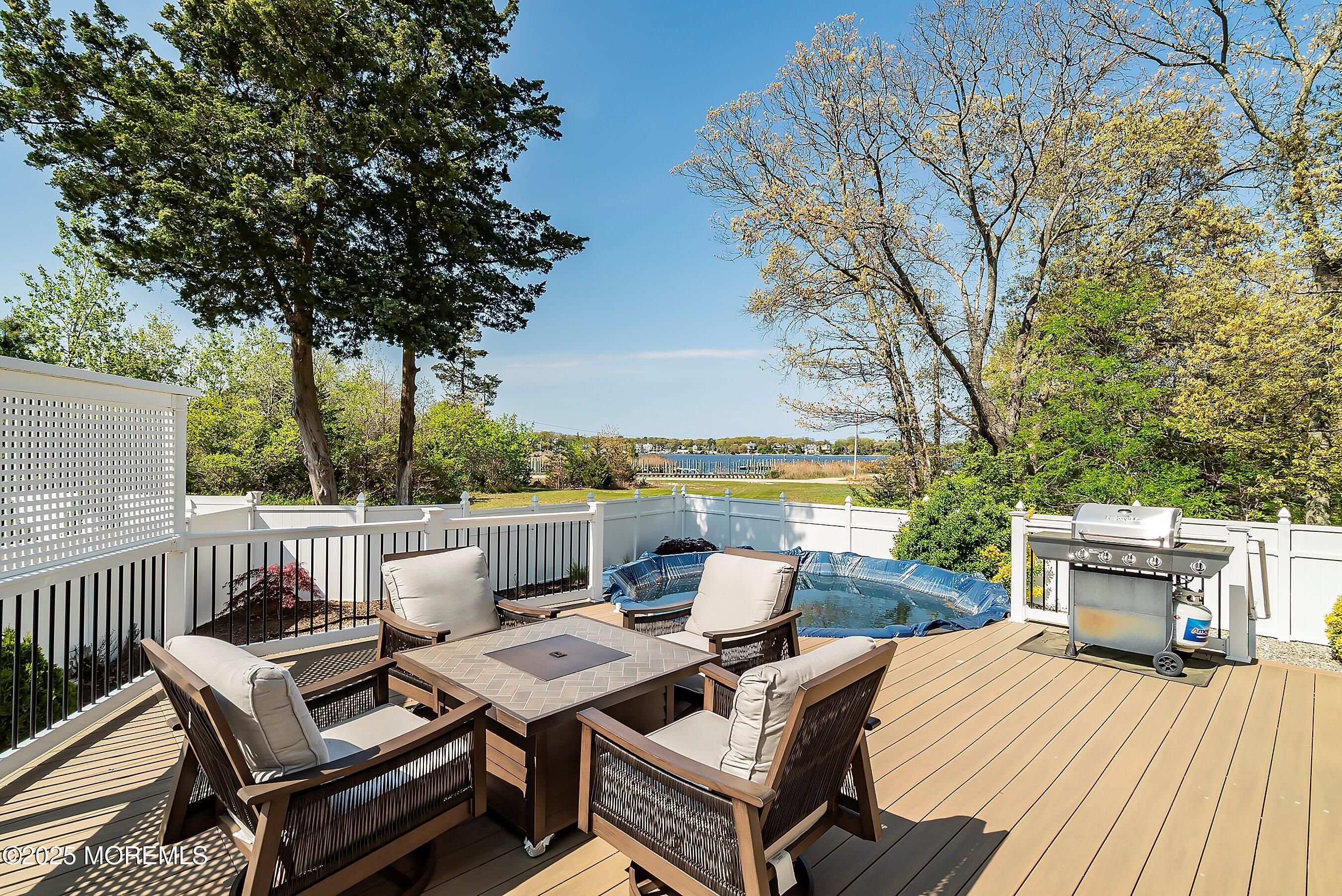 39 Ivy Court Bayville, NJ 08721 - Photo 28 of 33 a view of a patio with table and chairs and couches