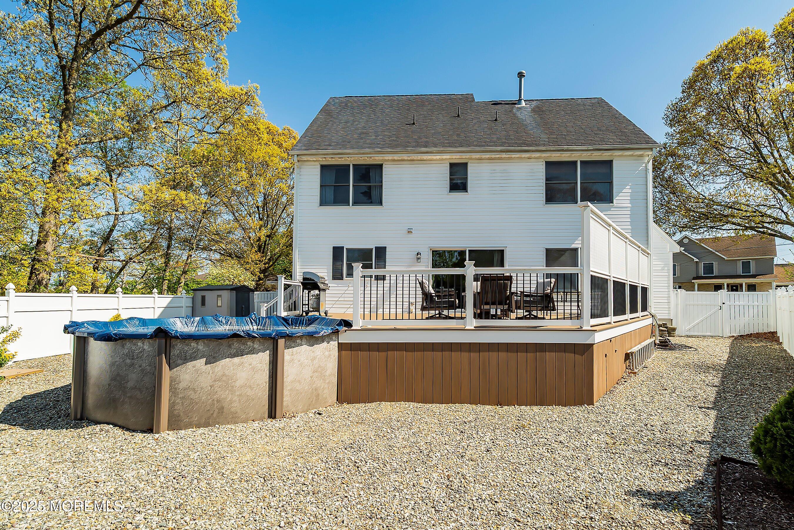 39 Ivy Court Bayville, NJ 08721 - Photo 29 of 33 a view of a house with pool and chairs