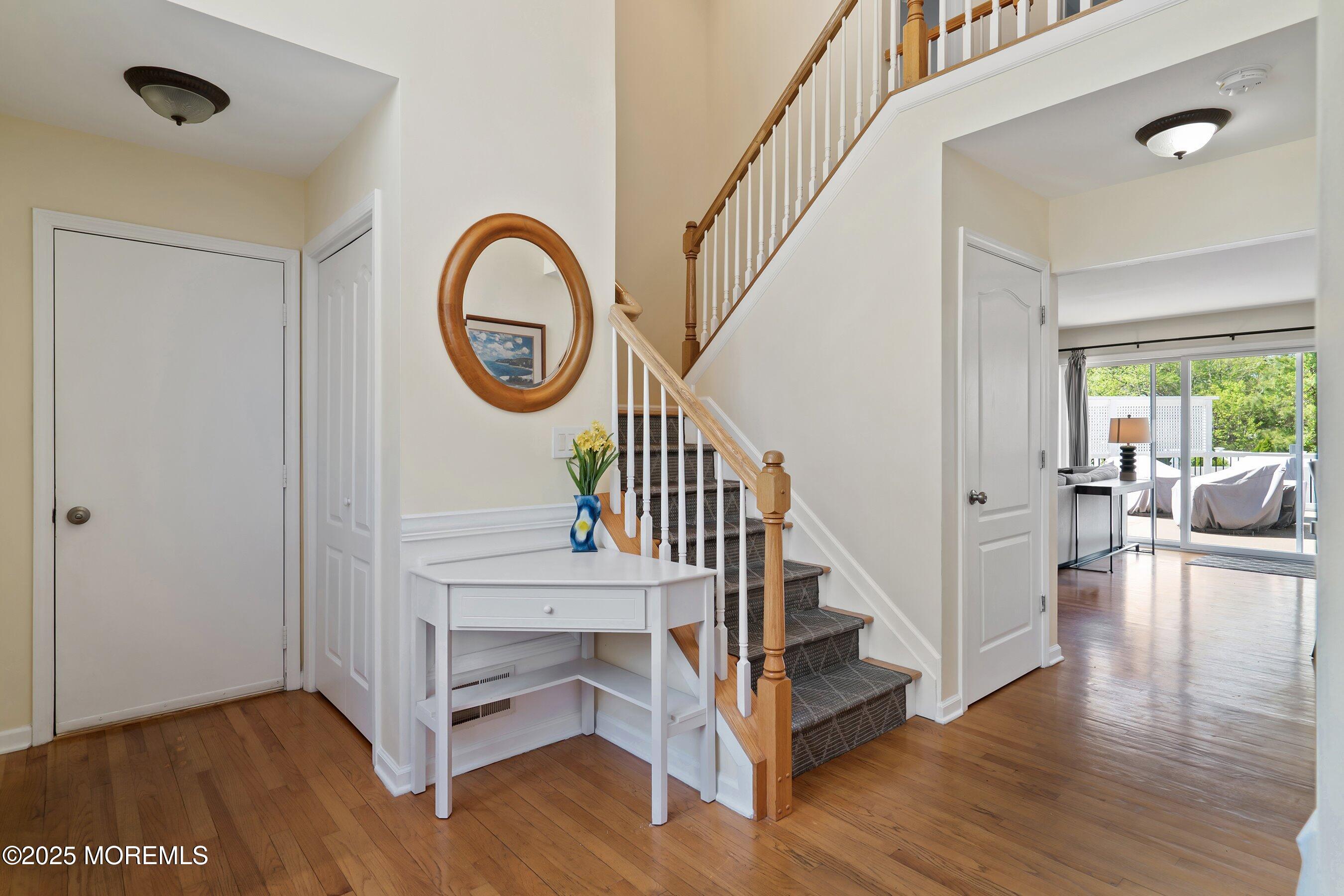 39 Ivy Court Bayville, NJ 08721 - Photo 31 of 33 a view of entryway with wooden floor and front door