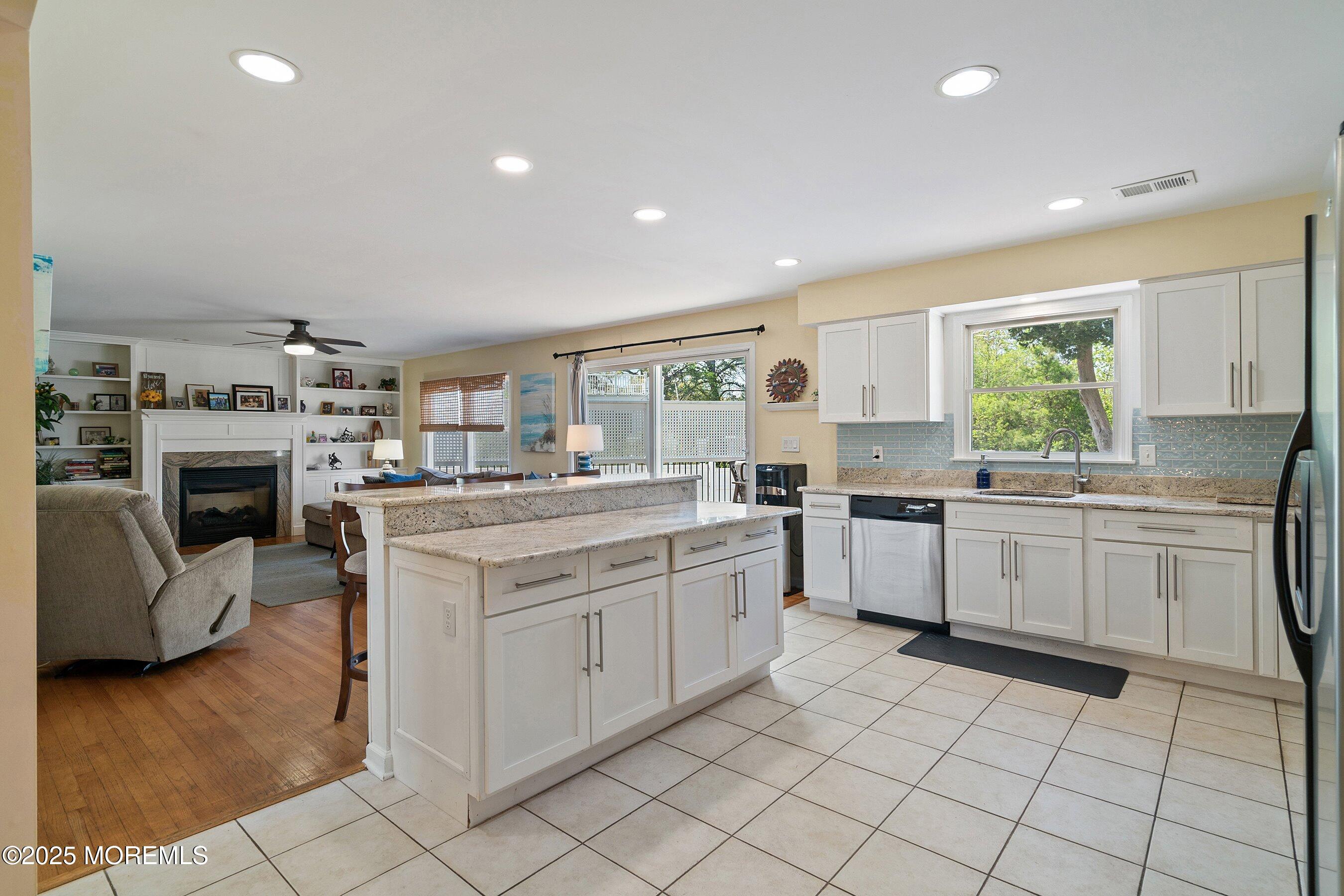 39 Ivy Court Bayville, NJ 08721 - Photo 4 of 33 a kitchen with a sink cabinets and window