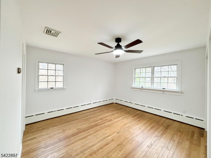 4 Baker Road Vernon, NJ 07461 - Photo 11 of 30 a view of a room with wooden floor and windows
