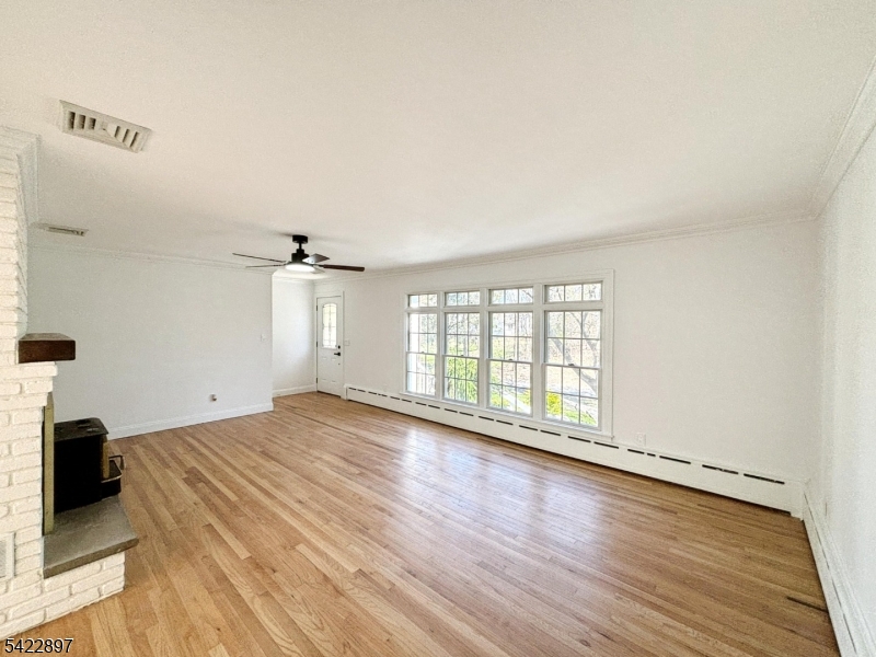 4 Baker Road Vernon, NJ 07461 - Photo 2 of 30 wooden floor in an empty room with a window