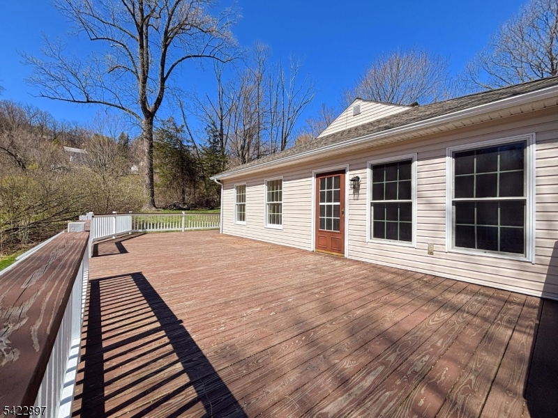 4 Baker Road Vernon, NJ 07461 - Photo 23 of 30 a view of a house with backyard and wooden roof