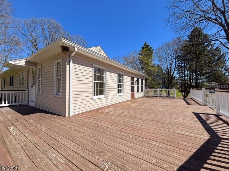 4 Baker Road Vernon, NJ 07461 - Photo 24 of 30 a backyard of a house with wooden floor