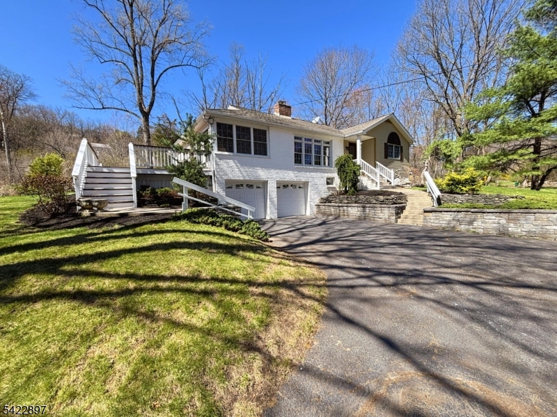 4 Baker Road Vernon, NJ 07461 - Photo 29 of 30 a view of a white house with pool and chairs