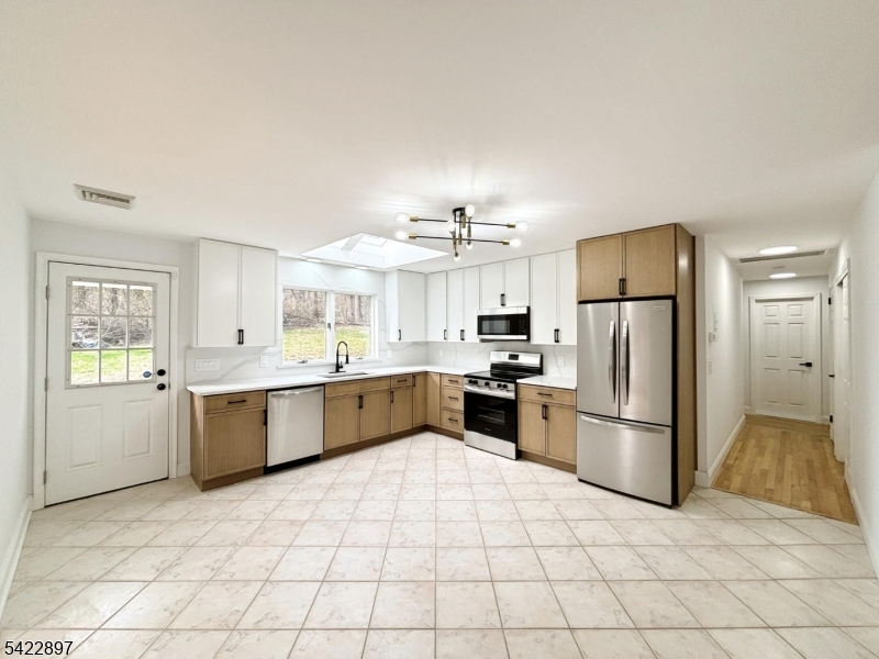 4 Baker Road Vernon, NJ 07461 - Photo 5 of 30 a large kitchen with a cabinets and stainless steel appliances