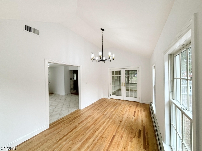 4 Baker Road Vernon, NJ 07461 - Photo 7 of 30 a view of a room with wooden floor chandelier and a window
