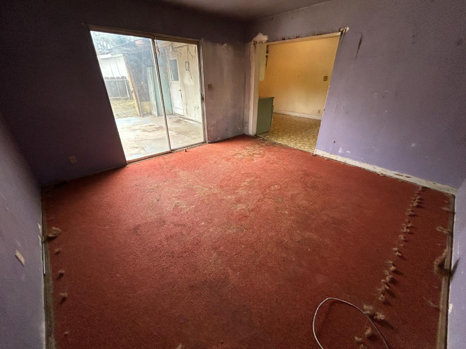 755 H Street Parlier, CA 93648 - Photo 12 of 22 an empty room with windows