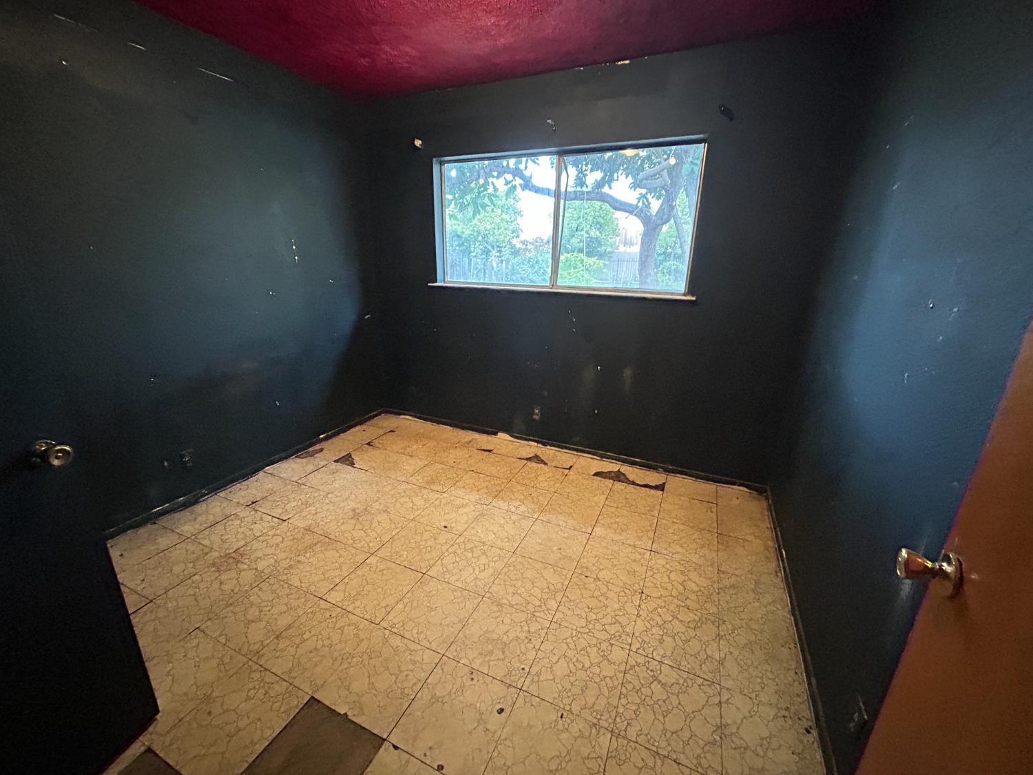 755 H Street Parlier, CA 93648 - Photo 16 of 22 a bed room with a bed and a window