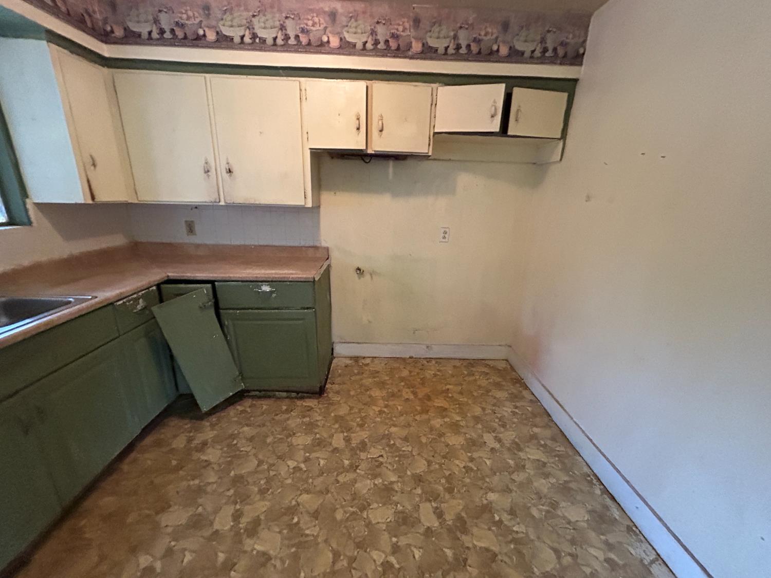 755 H Street Parlier, CA 93648 - Photo 9 of 22 a view of a kitchen with dishwasher and cabinets
