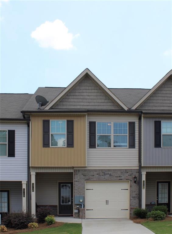 1714 Snapping Court Winder, GA 30680 - Photo 1 of 1 a front view of a house with garage