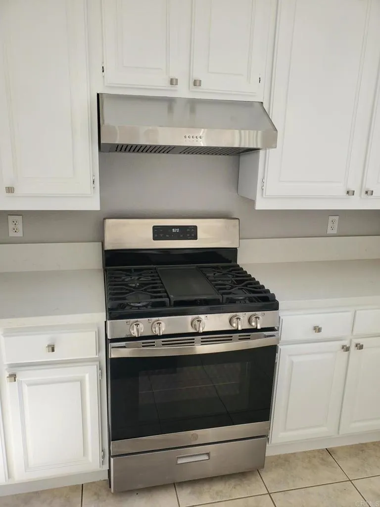 3619 Via Bernardo Oceanside, CA 92056 - Photo 4 of 8 a stove top oven sitting inside of a kitchen