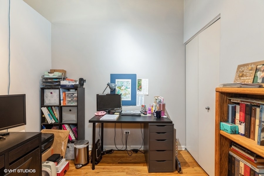 1070 West 15th Street, Unit 102 Chicago, IL 60608 - Photo 16 of 20 a view of a workspace with furniture