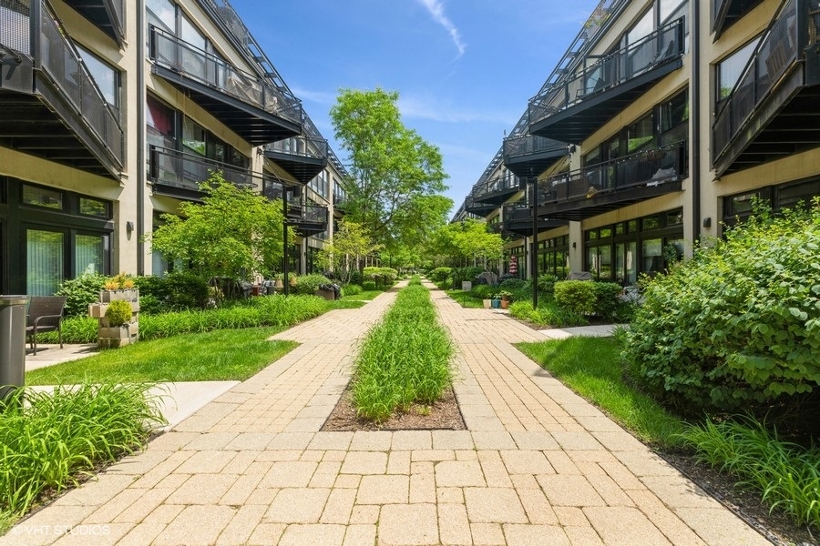 1070 West 15th Street, Unit 102 Chicago, IL 60608 - Photo 3 of 20 a view of a pathway with a house