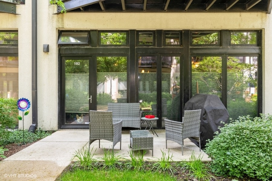 1070 West 15th Street, Unit 102 Chicago, IL 60608 - Photo 5 of 20 a view of a chairs and table in a patio