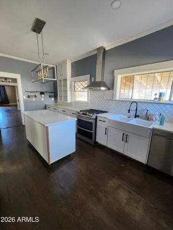 a view of a kitchen with wooden cabinet and a cabinet