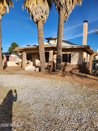 a view of a house with backyard of the house