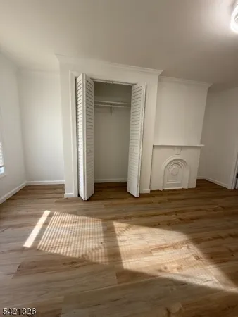 a view of a livingroom with wooden floor