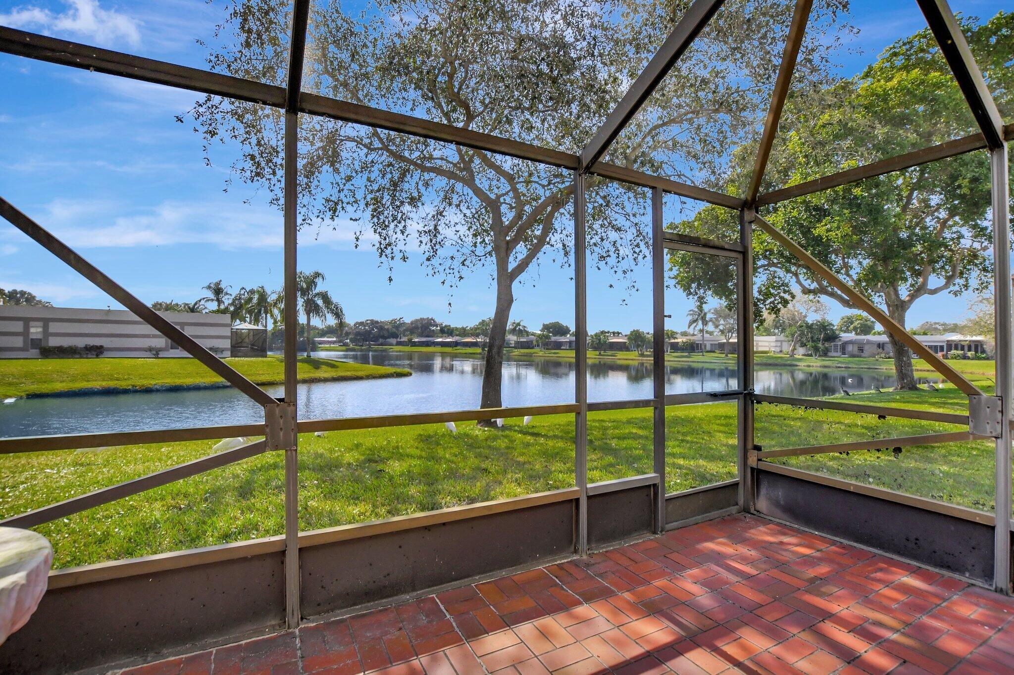 9214 Flynn Circle, Unit 6 Boca Raton, FL 33496 - Photo 18 of 36 Back Patio w/Lake View