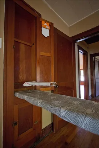 a bathroom with a granite countertop bathtub shower sink vanity and toilet