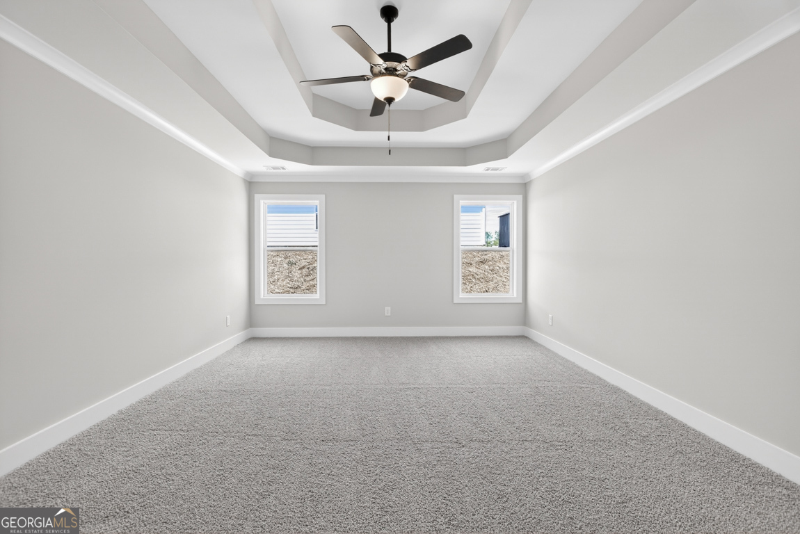 97 Wards Creek Road, Unit 1 Toccoa, GA 30577 - Photo 22 of 55 an empty room with a window and a ceiling fan
