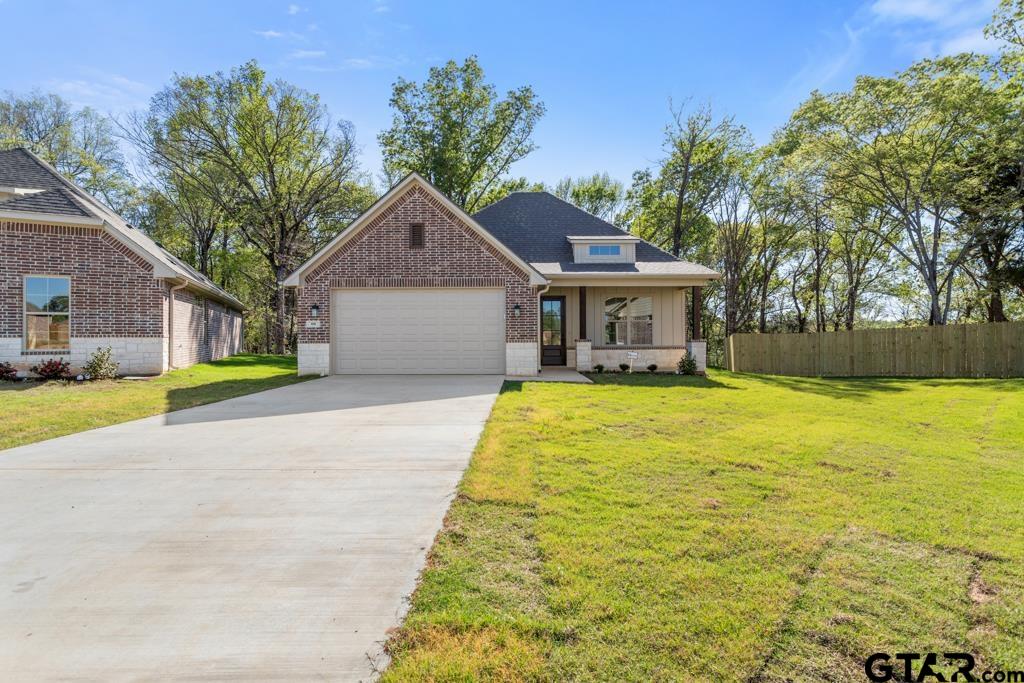 496 Preston Rdg Drive Tyler, TX 75703 - Photo 33 of 34 a front view of a house with a yard