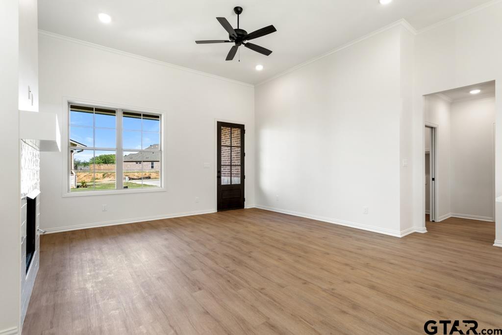 496 Preston Rdg Drive Tyler, TX 75703 - Photo 5 of 34 a view of an empty room with window and wooden floor