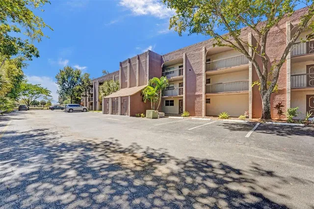 a view of a street with a building in the background