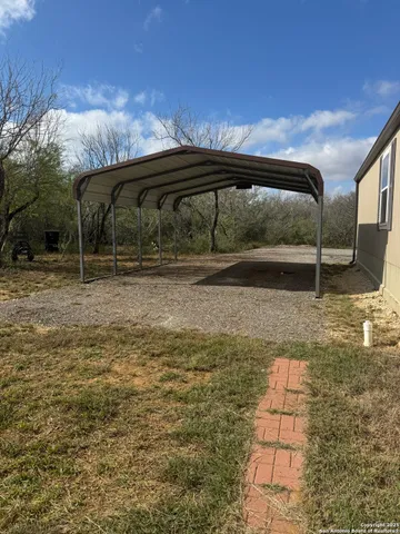 a house view with a backyard space