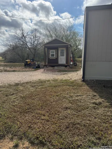 a kitchen with a sink appliances and cabinets