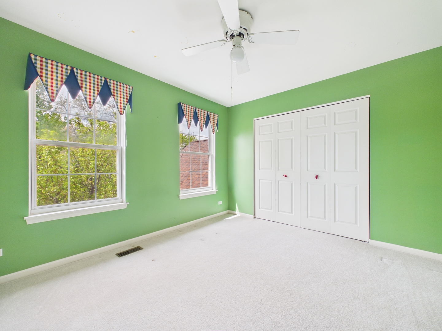 7486 Abbey Road Gurnee, IL 60031 - Photo 26 of 35 a view of an empty room with window ceiling fan and a window